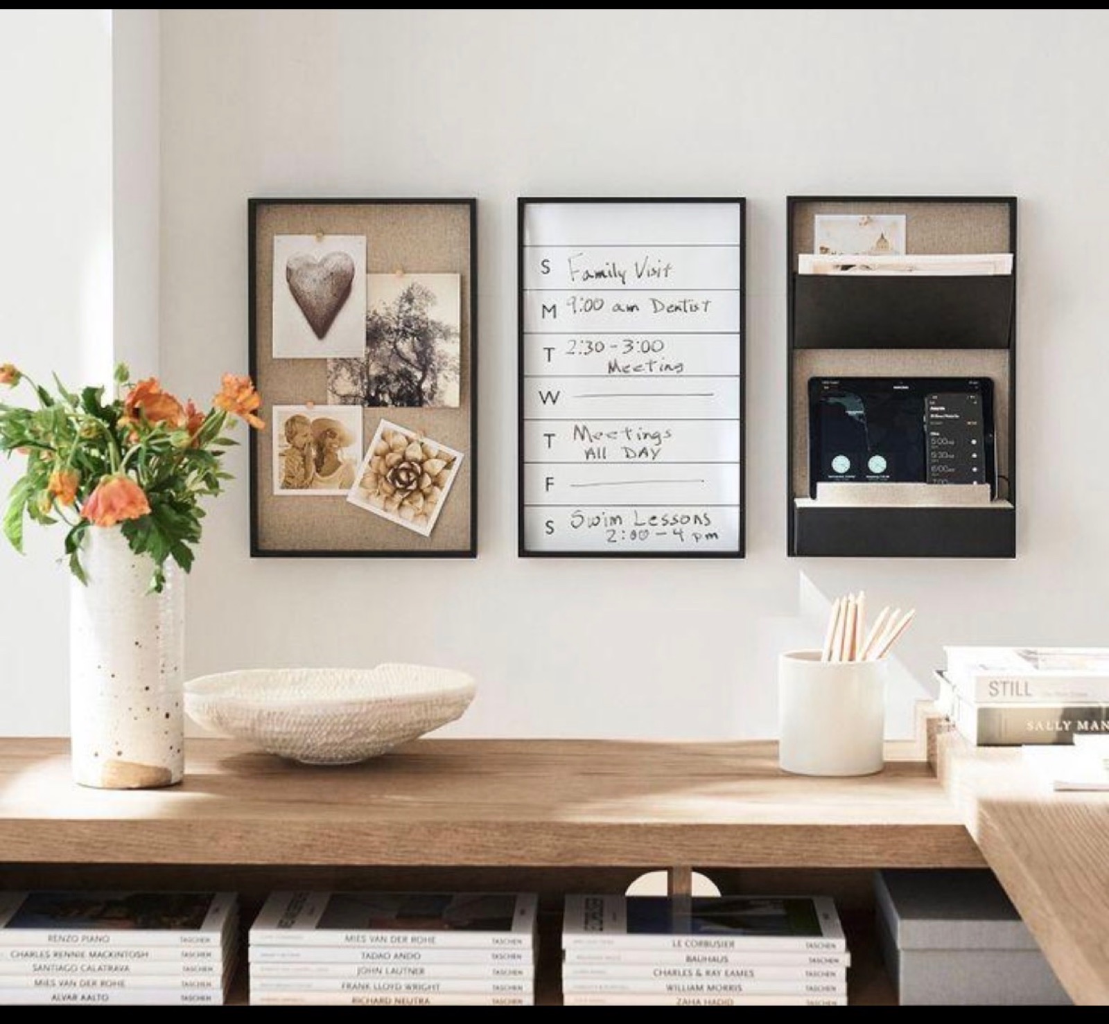 An organized wall planner and calendar system serving as a household command center.